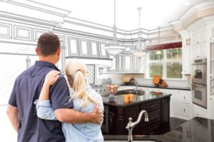 a man and woman kissing in a kitchen